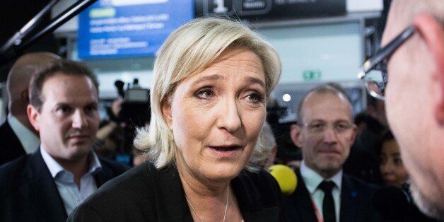 PARIS, FRANCE - FEBRUARY 01:  French far right National Front (FN) political party leader, member of the European Parliament, and candidate for the 2017 French Presidential Election Marine Le Pen (C) visits the Entrepreneurship Fair at the Palais des Congres on February 1, 2017 in Paris, France.  (Photo by Christophe Morin/IP3/Getty Images)