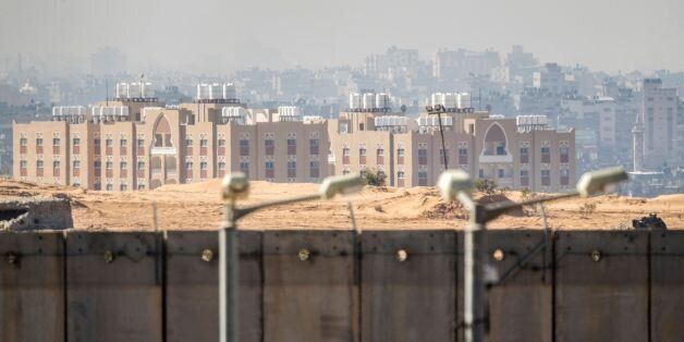 A picture taken from the southern Israel-Gaza Strip border on February 7, 2017 shows buildings in the the Gaza Strip behind Israel's controversial separation barrier. / AFP / JACK GUEZ        (Photo credit should read JACK GUEZ/AFP/Getty Images)
