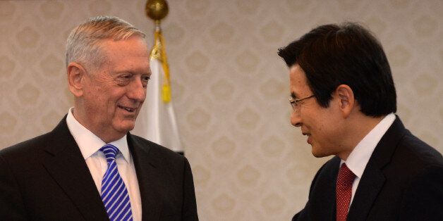 South Korea's acting President Hwang Kyo-ahn (R) greets US Defense Secretary James Mattis (L) prior their meeting at the Government Complex in Seoul on February 2, 2017.Mattis arrived in South Korea on February 2 on the first leg of a trip that also includes Japan, two key allies rattled by Donald Trump's isolationist ascent to power. / AFP / POOL / SONG Kyung-Seok        (Photo credit should read SONG KYUNG-SEOK/AFP/Getty Images)