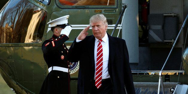 U.S. President Donald Trump returns a salute as he steps from Marine One upon his return to the White House in Washington February 6, 2017.  REUTERS/Kevin Lamarque