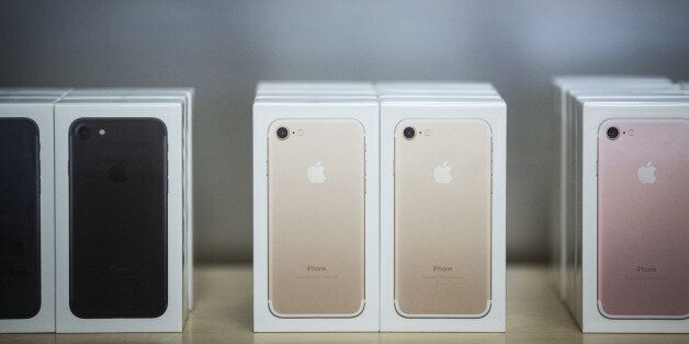 Boxes of iPhone 7 smartphones are displayed at an Apple Inc. in New York, U.S., on Friday, Sept. 16, 2016. Shoppers looking to buy Apple Inc.'s new iPhone 7 smartphones on Friday better have ordered ahead. Brisk demand left some stores sold out, leaving those who purchased online with the best chance to get their hands on the latest models -- and some resorting to extreme measures. Photographer: John Taggart/Bloomberg via Getty Images