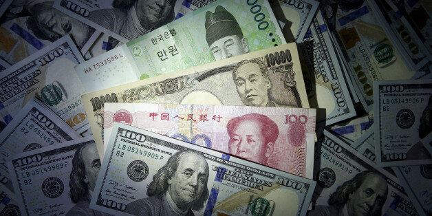 South Korean won, Chinese yuan and Japanese yen notes are seen on U.S. 100 dollar notes in this file photo illustration shot December 15, 2015. REUTERS/Kim Hong-Ji//Illustration/File Photo