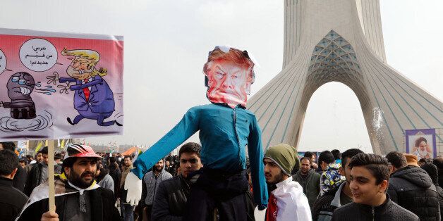 Iranians hold a dummy representing US President Donald Trump during a rally marking the anniversary of the 1979 Islamic revolution on February 10, 2017, in the capital Tehran.Millions of Iranians marched on the anniversary day in what President Hassan Rouhani described as a response to the new US administration and a rejection of 'threatening language'. / AFP / ATTA KENARE        (Photo credit should read ATTA KENARE/AFP/Getty Images)