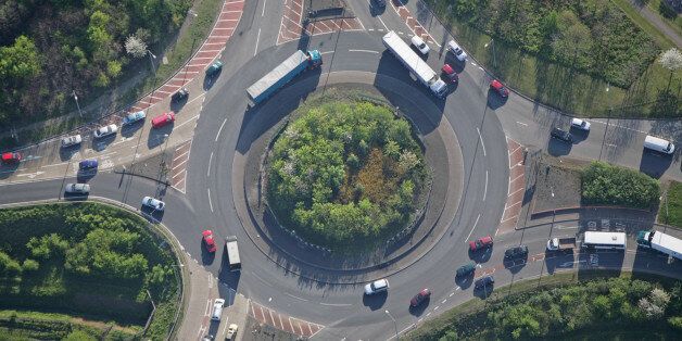 An aerial shot of a small but busy traffic island