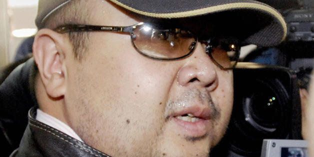 Beijing, CHINA: A man believed to be North Korean leader Kim Jong-Il's eldest son, Kim Jong-Nam, is surrounded by journalists upon his arrival at Beijing's capital airport, 11 February 2007. Wearing a cap, sunglasses and jeans, the man who Japanese television crew described as Kim Jong-Nam arrived at Beijing's airport from Macau in the afternoon, as six-nation talks on ending North Korea's nuclear weapons programme were underway in the Chinese capital.  Kim Jong-Nam, 35, was recently reported to