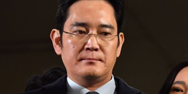 Lee Jae-yong, vice chairman of Samsung Electronics, arrives to be questioned as a suspect in a corruption scandal that led to the impeachment of South Korea's President Park Geun-Hye, at the office of the independent counsel in Seoul on February 13, 2017.  / AFP / POOL / JUNG Yeon-Je        (Photo credit should read JUNG YEON-JE/AFP/Getty Images)