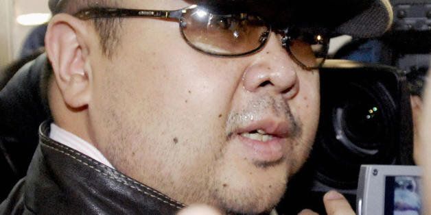 Beijing, CHINA: A man believed to be North Korean leader Kim Jong-Il's eldest son, Kim Jong-Nam, is surrounded by journalists upon his arrival at Beijing's capital airport, 11 February 2007. Wearing a cap, sunglasses and jeans, the man who Japanese television crew described as Kim Jong-Nam arrived at Beijing's airport from Macau in the afternoon, as six-nation talks on ending North Korea's nuclear weapons programme were underway in the Chinese capital.  Kim Jong-Nam, 35, was recently reported to have been living the high life in Macau, a southern China casino haven, for most of the past three years.  JAPAN OUT     AFP PHOTO / JAPAN POOL via JIJI PRESS (Photo credit should read AFP/AFP/Getty Images)