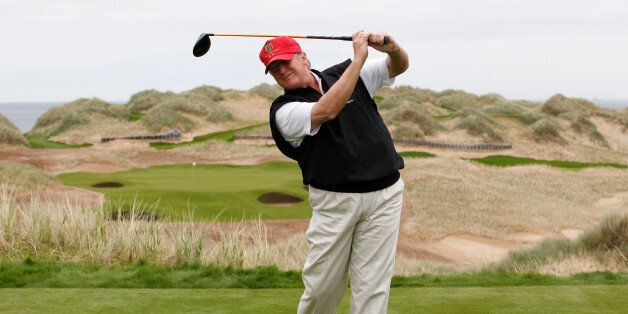 U.S. property magnate Donald Trump practices his swing at the 13th tee of his new Trump International Golf Links course on the Menie Estate near Aberdeen, Scotland, Britain June 20, 2011. To match Special Report USA-ELECTION/TRUMP-GOLF  REUTERS/David Moir/File Photo