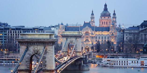a view of the Chain Bridge in budapest early in the evening