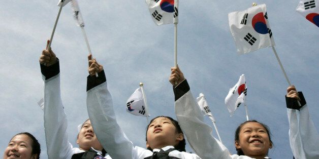 Girls wave national flags during the 90th anniversary of the Independence Movement at Independence Hall in Cheonan, about 92 km (57 miles) south of Seoul, March 1, 2009. Performers also re-enacted the March 1 Independence Movement against Japanese colonial rule in 1919 during which some 7,509 Koreans were killed, 15,961 were injured and 46,948 were arrested and put in prison by the Japanese army, which had forcibly occupied the Korean peninsula in 1910-1945, according to the South Korean governm