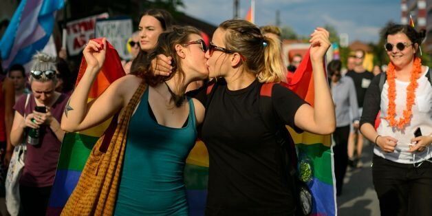 Women kiss as they take part in the Ljubljana Pride Parade in Ljubljana, Slovenia, on June 18, 2016. / AFP / JURE MAKOVEC        (Photo credit should read JURE MAKOVEC/AFP/Getty Images)