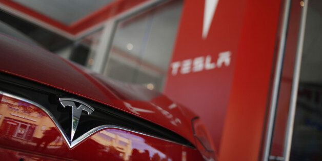 A Tesla Motors Inc. electric vehicle sits on display outside a company's store at the Easton Town Center shopping mall in Columbus, Ohio, U.S., on Tuesday, Aug. 23, 2016. The Conference Board is scheduled to release consumer confidence data on Aug. 30. Photographer: Luke Sharrett/Bloomberg via Getty Images