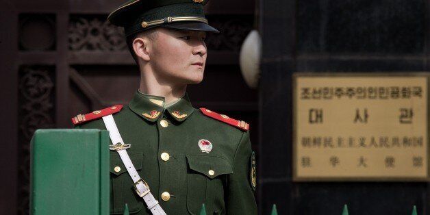 A paramilitary police officer stands guard in front of the North Korean embassy in Beijing on March 6, 2017.  Nuclear-armed North Korea launched four ballistic missiles in another challenge to President Donald Trump, with three landing provocatively close to America's ally Japan. / AFP PHOTO / NICOLAS ASFOURI        (Photo credit should read NICOLAS ASFOURI/AFP/Getty Images)