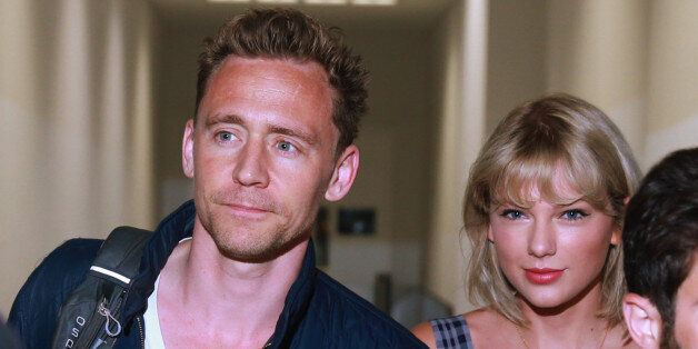 SYDNEY, AUSTRALIA - JULY 8: (EUROPE AND AUSTRALASIA OUT) Actor Tom Hiddleston and singer Taylor Swift arrive at Sydney International Airport in Sydney, New South Wales. The couple are then believed to have got a connecting flight to the Gold Coast. (Photo by Cameron Richardson/Newspix/Getty Images)