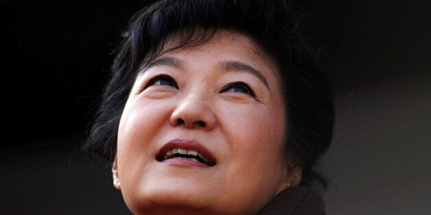 FILE PHOTO: South Korea's presidential candidate Park Geun-hye of the ruling Saenuri Party attends her election campaign rally in Suwon, about 46 km (29 miles) south of Seoul December 17, 2012.     REUTERS/Kim Hong-Ji/File Photo          TPX IMAGES OF THE DAY