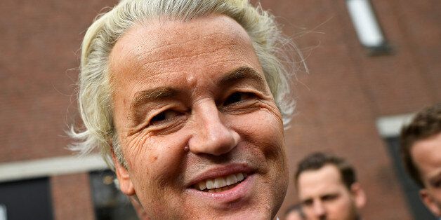 Dutch far-right politician Geert Wilders of the PVV party smiles during a rally in Heerlan, Netherlands, March 11, 2017. REUTERS/Dylan Martinez