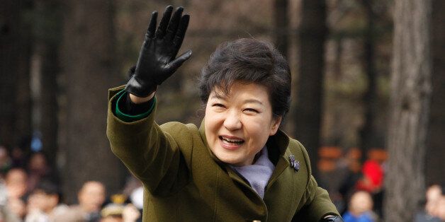 South Korea's new President Park Geun-Hye waves after her inauguration ceremony at parliament in Seoul on February 25, 2013. Park Geun-Hye became South Korea's first female president on February 25, vowing zero tolerance with North Korean provocation and demanding Pyongyang 'abandon its nuclear ambitions' immediately.   AFP PHOTO / POOL / Kim Hong-Ji        (Photo credit should read Kim Hong-Ji/AFP/Getty Images)