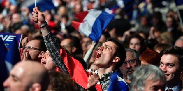 NANTES, FRANCE - FEBRUARY 26:  Far right supporters attend a presidential campaign rally by National Front Leader Marine Le Pen at the Zenith Metropole on February 26 2017 in Lyon, France. One of the most unpredictable French elections is being closely fought, with National Front leader promising to protect the electorate from globalization. The 48 year old daughter of the party founder Jean Marie Le Pen has manifesto pledges such as taxing job contracts for non-nationals and proposing to leave