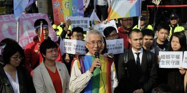 Veteran gay rights activist Chi Chia-wei (C) speaks to the press with his supporters in front of the Judicial Yuan in Taipei on March 24, 2017.Taiwan's constitutional court began hearing a landmark case on March 24 that could make the island the first place in Asia to allow same-sex marriage. / AFP PHOTO / SAM YEH        (Photo credit should read SAM YEH/AFP/Getty Images)