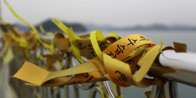 JINDO-GUN, SOUTH KOREA - MARCH 24:  Tribute flags to victims of the Sewol ferry disaster displayed on a pier at Paengmok harbour on March 24, 2017 in Jindo-gun, South Korea. The Sewol sank off the Jindo Island in April 2014 leaving more than 300 people dead and nine of them still remain missing. Workers are in the process of an attempt to raise the ferry from the water in the hope that the disasters' final victims will be found. (Photo by Chung Sung-Jun/Getty Images)