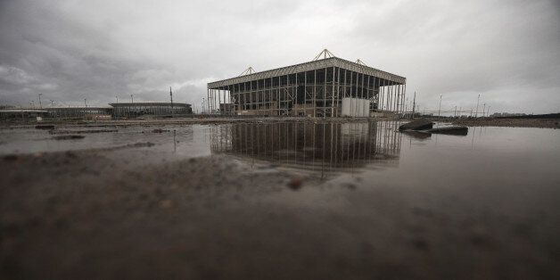 RIO DE JANEIRO, BRAZIL - MARCH 18:  A puddle sits in front of the Olympic Aquatics stadium at Olympic Park on March 18, 2017 in Rio de Janeiro, Brazil. Seven months after the Rio hosted the first Olympic games in South America, many of the costly venue sites have been mostly abandoned in spite of promises from organizers that the games would provide a legacy benefit for the citizens of Brazil. The country remains in a deep economic and political crisis following the games. Critics believe the mo
