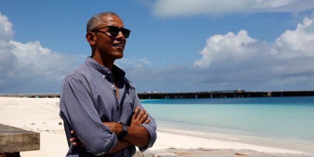 U.S. President Barack Obama smiles as he looks out at Turtle Beach on a visit to Papahanaumokuakea Marine National Monument, Midway Atoll, U.S., September 1, 2016. REUTERS/Jonathan Ernst