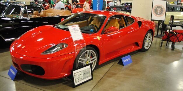 A Ferrari F430 owned by US president Donald J. Trump in 2007 is exhibited by Autcions America in Fort Lauderdale, Florida on March 31, 2017. The auction will take place on April 1, 2017 and is expected to fetch $250,000 to $350,000 US dollars.  / AFP PHOTO / Leila MACOR / TO GO WITH AFP STORY BY LEILA MACOR        (Photo credit should read LEILA MACOR/AFP/Getty Images)