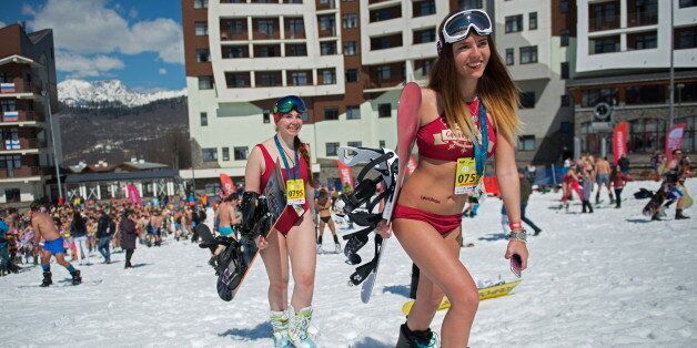 SOCHI, RUSSIA - APRIL 1, 2017: People dressed in swimsuits participate in the BoogelWoogel alpine carnival at the Rosa Khutor Alpine Resort in Krasnaya Polyana, Sochi. Artur Lebedev/TASS (Photo by Artur LebedevTASS via Getty Images)