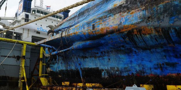 MOKPO, SOUTH KOREA - APRIL 1: In this handout photo released by the South Korean Ministry of Oceans and Fisheries, The sunken ferry Sewol sitting on a semi-submersible transport vessel arrived at a port in Mokpo on April 1, 2017 in Mokpo, South Korea. The Sewol sank off the Jindo Island in April 2014 leaving more than 300 people dead and nine of them still remain missing. (Photo by South Korean Ministry of Oceans and Fisheries via Getty Images)