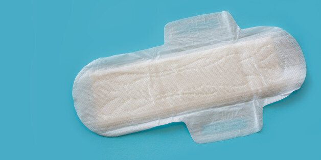 Sanitary napkin  with flaps on blue clean for use ready to fly