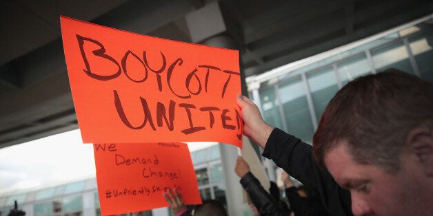 CHICAGO, IL - APRIL 11:  Demonstrators protest outside the United Airlines terminal at O'Hare International Airport on April 11, 2017 in Chicago, Illinois. United Airlines has been struggling to restore their corporate image after a cell phone video was released showing a passenger being dragged from his seat and bloodied by airport police after he refused to leave a reportedly overbooked flight.  (Photo by Scott Olson/Getty Images)