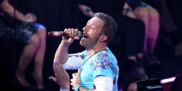 INGLEWOOD, CA - MARCH 05:  Singer-songwriter Chris Martin of Coldplay performs onstage at the 2017 iHeartRadio Music Awards which broadcast live on Turner's TBS, TNT, and truTV at The Forum on March 5, 2017 in Inglewood, California.  (Photo by Rich Polk/Getty Images for iHeartMedia)