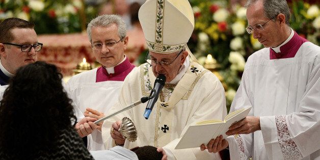 S PETER, VATICAN, LAZIO - 2017/04/15: Pope Francis in St. Peter's Basilica, celebrated the vigil that precedes Easter. The ritual began in the atrium of the basilica with the blessing of fire and preparation of the paschal candle. After the procession and liturgy, the Pope gave to the sacraments of Baptism, Confirmation and First Communion at 11 newcomers from different parts of the world. (Photo by Andrea Franceschini/Pacific Press/LightRocket via Getty Images)