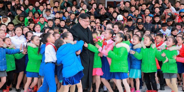 North Korean leader Kim Jong Un is hugged by children during his visit to Samjiyon County in this undated photo released by North Korea's Korean Central News Agency (KCNA) in Pyongyang November 28, 2016. REUTERS/KCNA   ATTENTION EDITORS - THIS IMAGE WAS PROVIDED BY A THIRD PARTY. EDITORIAL USE ONLY. REUTERS IS UNABLE TO INDEPENDENTLY VERIFY THIS IMAGE. NO THIRD PARTY SALES. NOT FOR USE BY REUTERS THIRD PARTY DISTRIBUTORS. SOUTH KOREA OUT. NO COMMERCIAL OR EDITORIAL SALES IN SOUTH KOREA.       TP