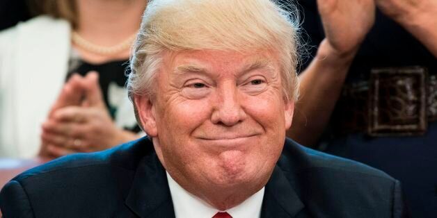 US President Donald Trump smiles during a national teacher of the year event in the Oval Office of the White House April 26, 2017 in Washington, DC. / AFP PHOTO / Brendan Smialowski        (Photo credit should read BRENDAN SMIALOWSKI/AFP/Getty Images)
