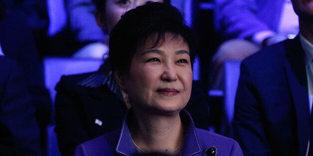 South Korea's president Park Geun-Hye (L) attends a K-Pop concert, the KCON 2016, at the Bercy Arena, in Paris, on June 2, 2016. / AFP / POOL / Thibault Camus        (Photo credit should read THIBAULT CAMUS/AFP/Getty Images)
