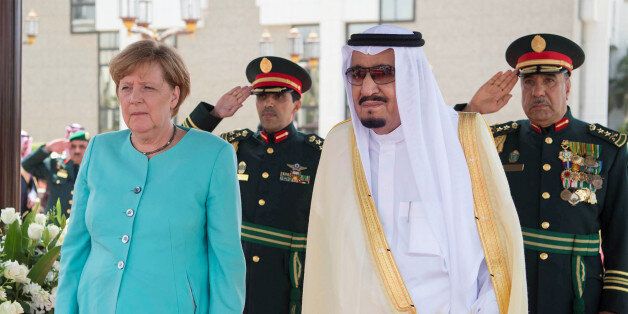 Saudi Arabia's King Salman bin Abdulaziz Al Saud stands next to German Chancellor Angela Merkel during a reception ceremony in Jeddah, Saudi Arabia April 30, 2017. Bandar Algaloud/Courtesy of Saudi Royal Court/Handout via REUTERS    ATTENTION EDITORS - THIS PICTURE WAS PROVIDED BY A THIRD PARTY. FOR EDITORIAL USE ONLY.
