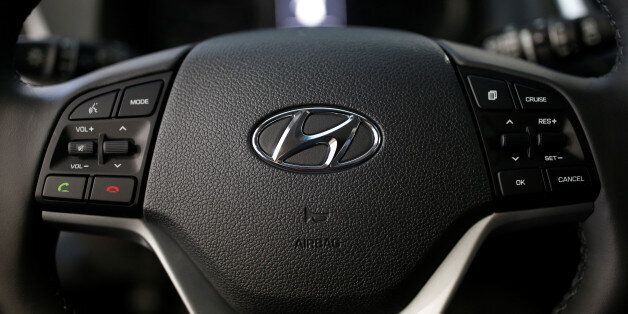 The logo of Hyundai Motor is seen on a steering wheel at its dealership in Seoul, South Korea, December 15, 2016. Picture taken December 15, 2016.   REUTERS/Kim Hong-Ji