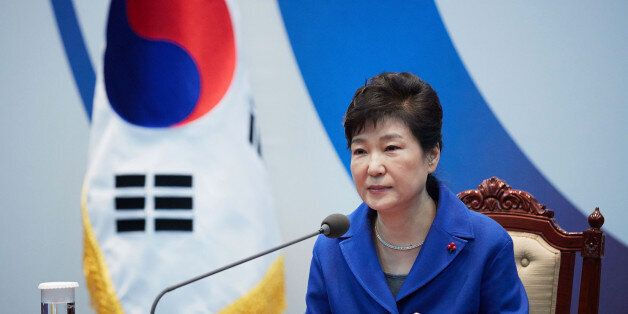 SEOUL, SOUTH KOREA - DECEMBER 09:  In this handout photo released by the South Korean Presidential Blue House, South Korea's President Park Geun-Hye attends the emergency cabinet meeting at the presidential office on December 9, 2016 in Seoul, South Korea. The South Korean National Assembly voted for an impeachment motion at its plenary session, which will set up the rare impeachment trial for President Park over the accusation of corruption involving Park and her long time confidante.  (Photo b