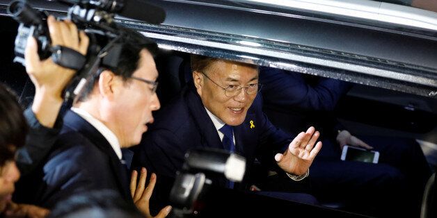 South Korea's president-elect Moon Jae-in leaves his house to meet supporters at Gwanghwamun Square in Seoul, South Korea May 9, 2017. REUTERS/Kim Hong-Ji