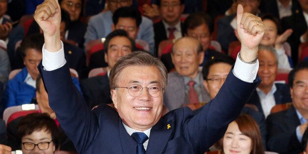 Moon Jae-in, the presidential candidate of the Democratic Party of Korea, speaks to the media after voting at a polling station in Seoul, South Korea, May 9, 2017. REUTERS/Kim Kyung-Hoon