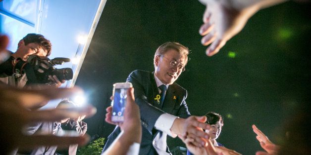 SEOUL, SOUTH KOREA - MAY 09:  Mr. Moon Jae-in, the president-elect, greets supporters after his victory was confirmed on the presidential election on May 9, 2017 in Seoul, South Korea. The liberal presidential candidate had some 6.25 million, or 39.5 percent, of the 15.88 million votes counted so far, according to the National Election Commission. (Photo by Jean Chung/Getty Images)