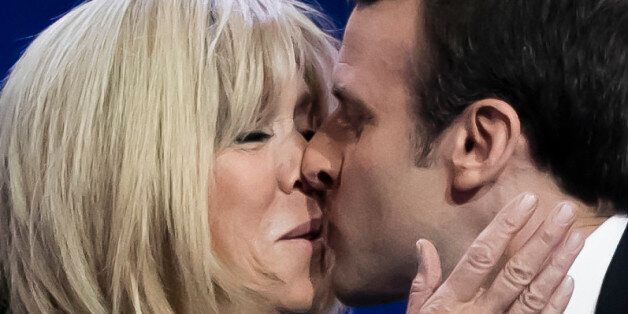 PARIS, FRANCE - APRIL 23:  Founder and Leader of the political movement 'En Marche !' and presidential candidate Emmanuel Macron (R), with his wife Brigitte Trogneux (L), addresses activists after the announcement of the French presidential Election results on April 23, 2017 in Paris, France. According to projected results, founder and leader of the political movement 'En Marche !' Emmanuel Macron has received the most votes with National Front Party leader Marine Le Pen in second place, meaning