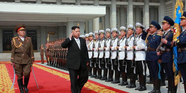 This April 15, 2017 picture released from North Korea's official Korean Central News Agency (KCNA) on April 16, 2017 shows North Korean leader Kim Jong-Un (C) arriving for a military parade in Pyongyang marking the 105th anniversary of the birth of late North Korean leader Kim Il-Sung. / AFP PHOTO / KCNA VIA KNS / STR / South Korea OUT / REPUBLIC OF KOREA OUT   ---EDITORS NOTE--- RESTRICTED TO EDITORIAL USE - MANDATORY CREDIT 'AFP PHOTO/KCNA VIA KNS' - NO MARKETING NO ADVERTISING CAMPAIGNS - DIS