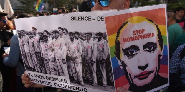 MADRID, SPAIN - 2017/04/25: A man holds a picture of Vladimir Putin as he takes part in a protest in Madrid against the persecution of gay men in Chechnya. (Photo by Jorge Sanz GarcÃ­a/Pacific Press/LightRocket via Getty Images)