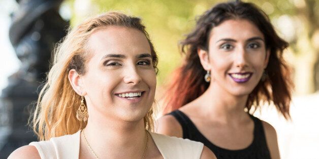Two female transgender friends looking at camera, cheerful expression