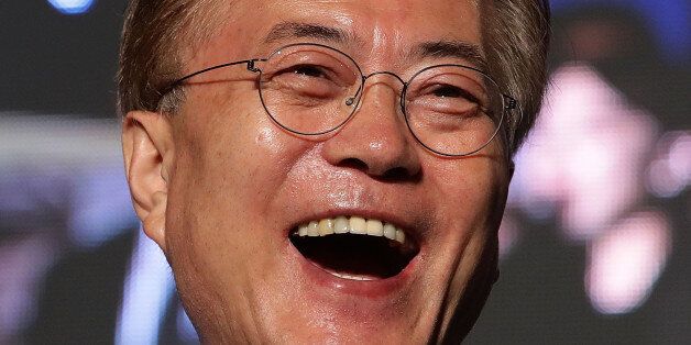SEOUL, SOUTH KOREA - MAY 09:  South Korean President-elect Moon Jae-in, of the Democratic Party of Korea, celebrates with supporters at Gwanghwamun Square on May 9, 2017 in Seoul, South Korea. Moon Jae-in declared victory in South Korea's presidential election, which was called seven months early after former President Park Geun-hye was impeached for her involvement in a corruption scandal.  (Photo by Chung Sung-Jun/Getty Images)