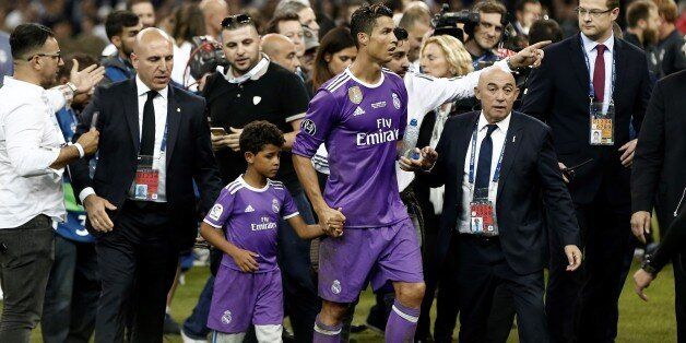 CARDIFF, WALES - JUNE 3: Real Madrid's Cristiano Ronaldo celebrates with his son Cristiano JR. after winning the UEFA Champions League final between Juventus FC and Real Madrid at the National Stadium of Wales in Cardiff, on June 3, 2017. (Photo by Burak Akbulut/Anadolu Agency/Getty Images)