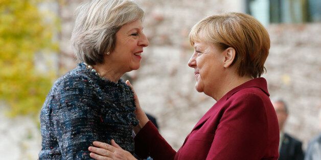 Britain's Prime Minister Theresa May is welcomed by German Chancellor Angela Merkel upon her arrival at the chancellery in Berlin, Germany, November 18, 2016. REUTERS/Fabrizio Bensch
