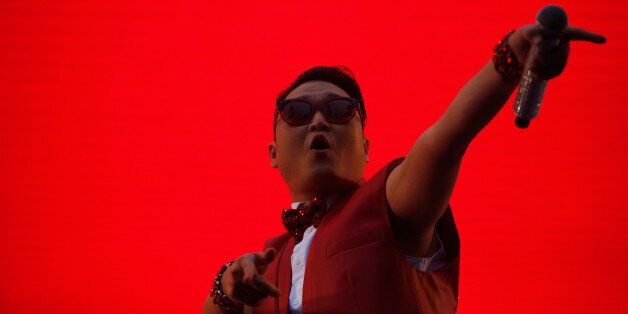 South Korean rapper Psy performs during a public screening before the 2014 World Cup Group H soccer match between South Korea and Russia, in Seoul June 18, 2014.  REUTERS/Kim Hong-Ji (SOUTH KOREA - Tags: ENTERTAINMENT SOCIETY SPORT SOCCER WORLD CUP TPX IMAGES OF THE DAY)